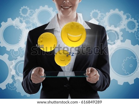 Digital composite of Business woman with glass device and emojis with flare against blue background with gears