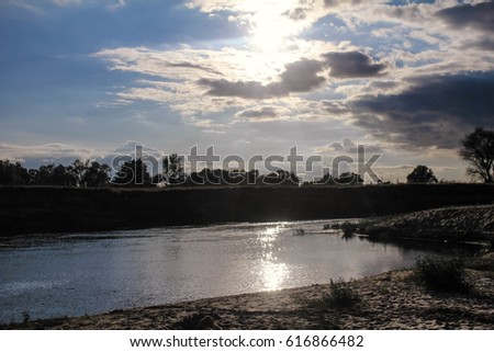 River in forest river landscape. Water surface with ripples and sunrays reflection. Summer river shore landscape. fantastic panoramic landscape, place. Photography, image