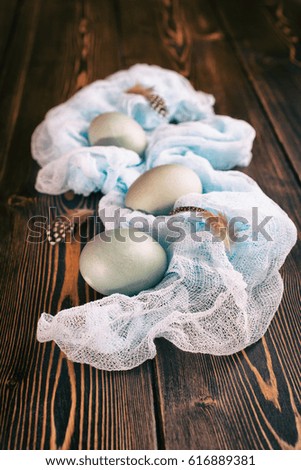 Gray Easter eggs wrapped with vintage fabric, toned picture. Vintage style, copy space for text.