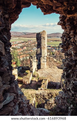 View from the ruins of Divin castle, Slovak republic. Travel destination. Vertical composition. Retro photo filter. Ancient architecture.