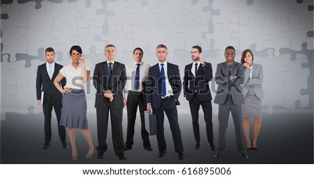Digital composite of Digitally generated image of business people with puzzle pieces in background