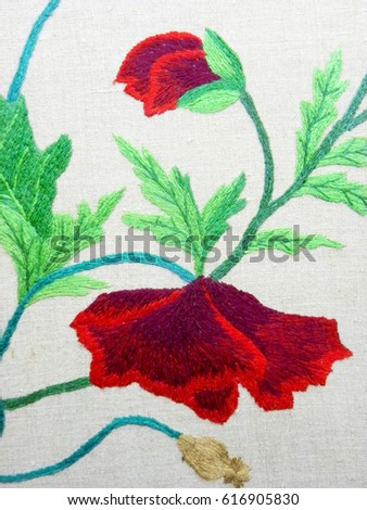 embroidered bouquet of poppies on white fabric, Ukrainian folk embroidery, decorated fabric