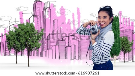 Digital composite of Digital composite image of woman holding camera against buildings