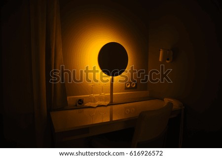 Mirror lamp night light in a dark background. Vintage effect style picture.