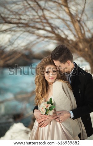 Beautiful young couple in love outdoors in spring