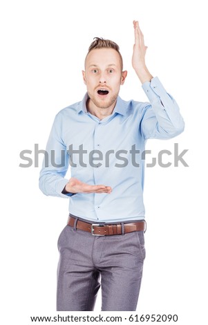 portrait young man pointing up, showing something, having an idea. emotions, facial expressions, feelings, body language, signs. image on a white studio background.