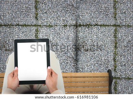 Digital composite of woman sitting with tablet
