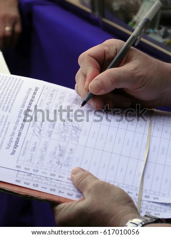 Man signing a petition for a public referendum in Seattle          Royalty-Free Stock Photo #617010056