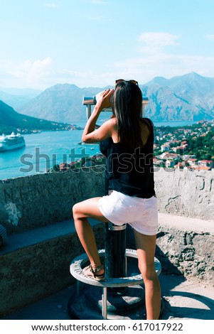 Girl looking panorama of the Perast in Boka Kotor Bay, Montenegro, Balkans 
