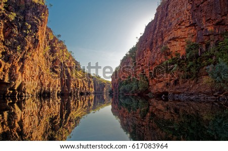 Katherine Gorge on an early morning boat trip up the river with wonderful reflections and beautiful scenery,  Northern Territory,  Central Australia. Royalty-Free Stock Photo #617083964