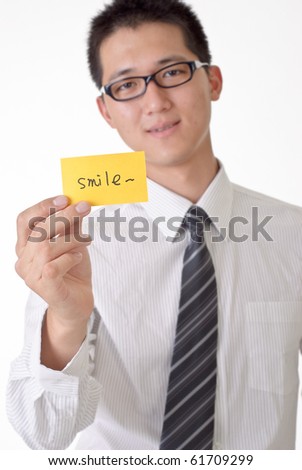 Smile card holding by happy business man, focus on yellow card.