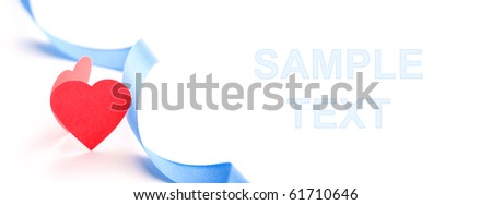 Red paper heart with blue silk ribbon isolated on white. Closeup. Celebratory and easy editable image.