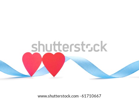 Two red paper hearts with blue silk ribbon isolated on white. Closeup. Celebratory image.