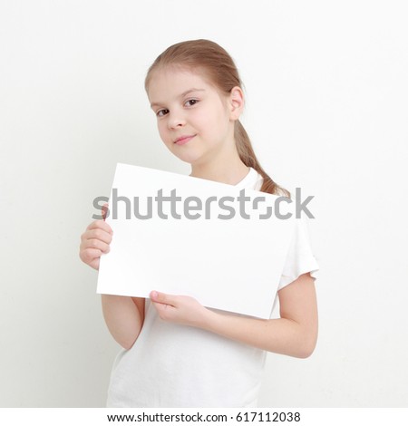 little girl holding empty white blank