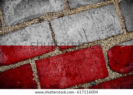Polish national flag (grunge) on the texture of the old cracked brick and rubble