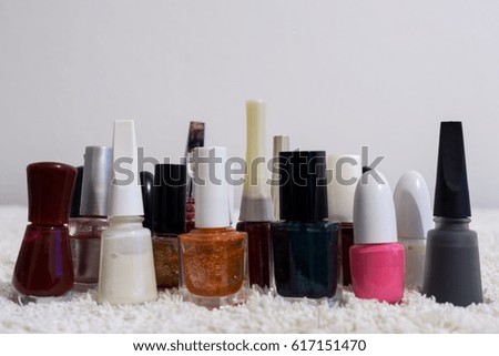 Nail polishes of many colors on a table