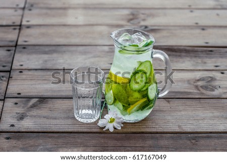 Cucumber Homemade lemonade in a decanter with a glass