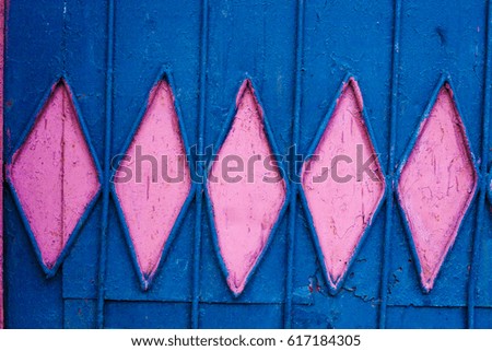 Blue metal wall with rhombuses