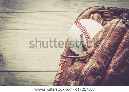 Old worn used leather baseball sport glove over aged