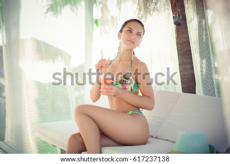 woman with a cocktail on the terrace