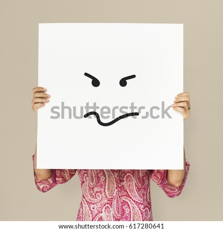 Adult woman holding placard studio portrait