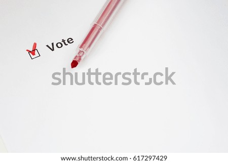Questionnaire. Red pen and the inscription Vote with check mark on white paper