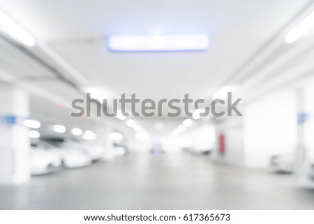 Abstract blur shopping mall store interior for background,parking area.