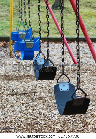 Playground Swingset Royalty-Free Stock Photo #617367938