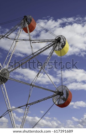 Ferris wheel at summer carnival.