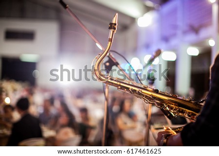 saxophone player  Royalty-Free Stock Photo #617461625