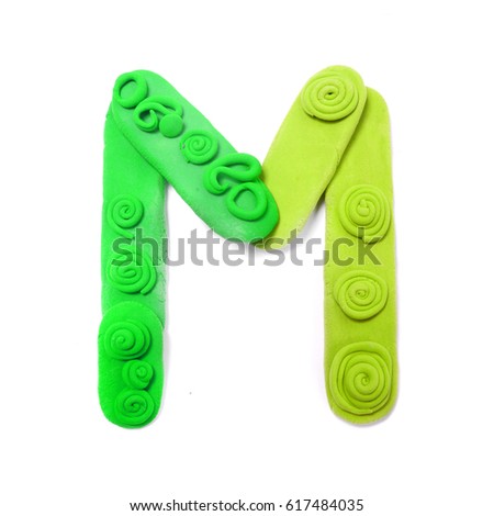Plasticine letter M. Color plasticine alphabet, isolated.