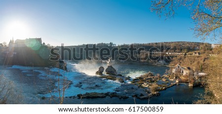 Large panoramic view of waterfall on the river Rhine, Rheinfall, Switzerland. The Rhine Falls is the largest waterfall in Europe.