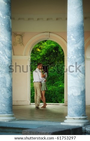 young couple dancing in old park theater