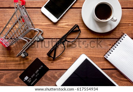 concept online shopping with smartphone on wooden background moc