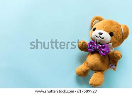 The teddy bear on blue background