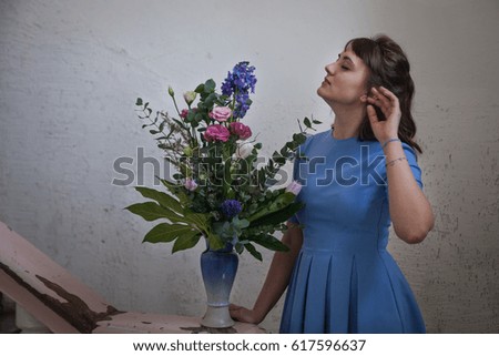 Girl in blue dress with flowers