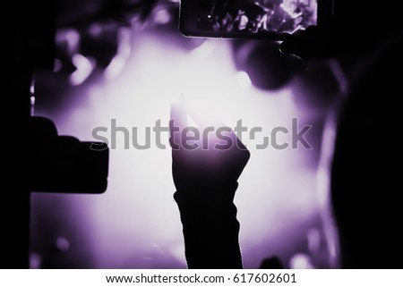 blurred Capture video at a concert at the camera in a bright spotlight lamps