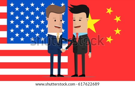 Two businessmen handshake next to the American and Chinese flags