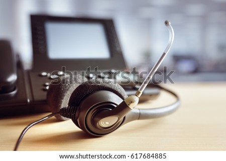 VOIP headset headphones and telephone concept for communication, it support, call center and customer service help desk Royalty-Free Stock Photo #617684885
