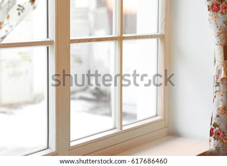 Large wooden window with beautiful curtains in sunny day Royalty-Free Stock Photo #617686460