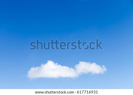 White fluffy clouds in the blue sky 