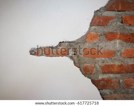 Destroyed Concrete with a black hold and Brick wall Background of crack brick wall texture Rough old brick wall grunge texture with cracks