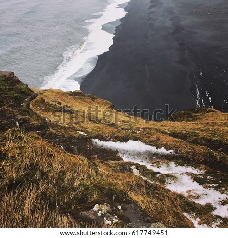 Black sand beach landscape, Dyrholaey peninsula, South coast of Iceland, square photo