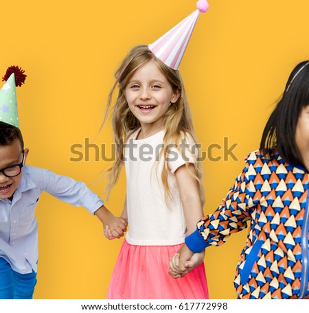 Diverse Group Of Kids Holding Hands in Festive Hat 