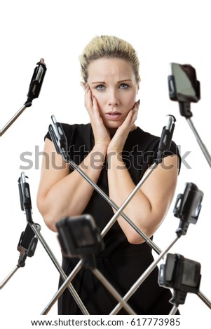 woman surrounded by phones on selfie stick