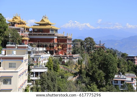 General view of Thrangu Tashi Yangtse Monastery,   located at Namo Buddha, the most sacred Buddhist site in Nepal with the snow capped Himalayas in the background Royalty-Free Stock Photo #617775296