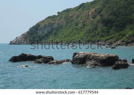Coastal rocks and blue waters.