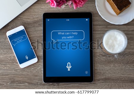 computer PC tablet and touch phone with app personal assistant screen on table  Royalty-Free Stock Photo #617799077