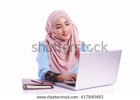 Pretty woman wearing hijab in front of laptop search and doing office work with different face expression isolated in white background - office, business, finance and work station concept