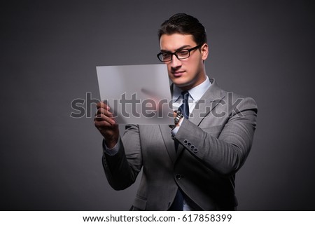 Handsome businessman working on tablet computer
